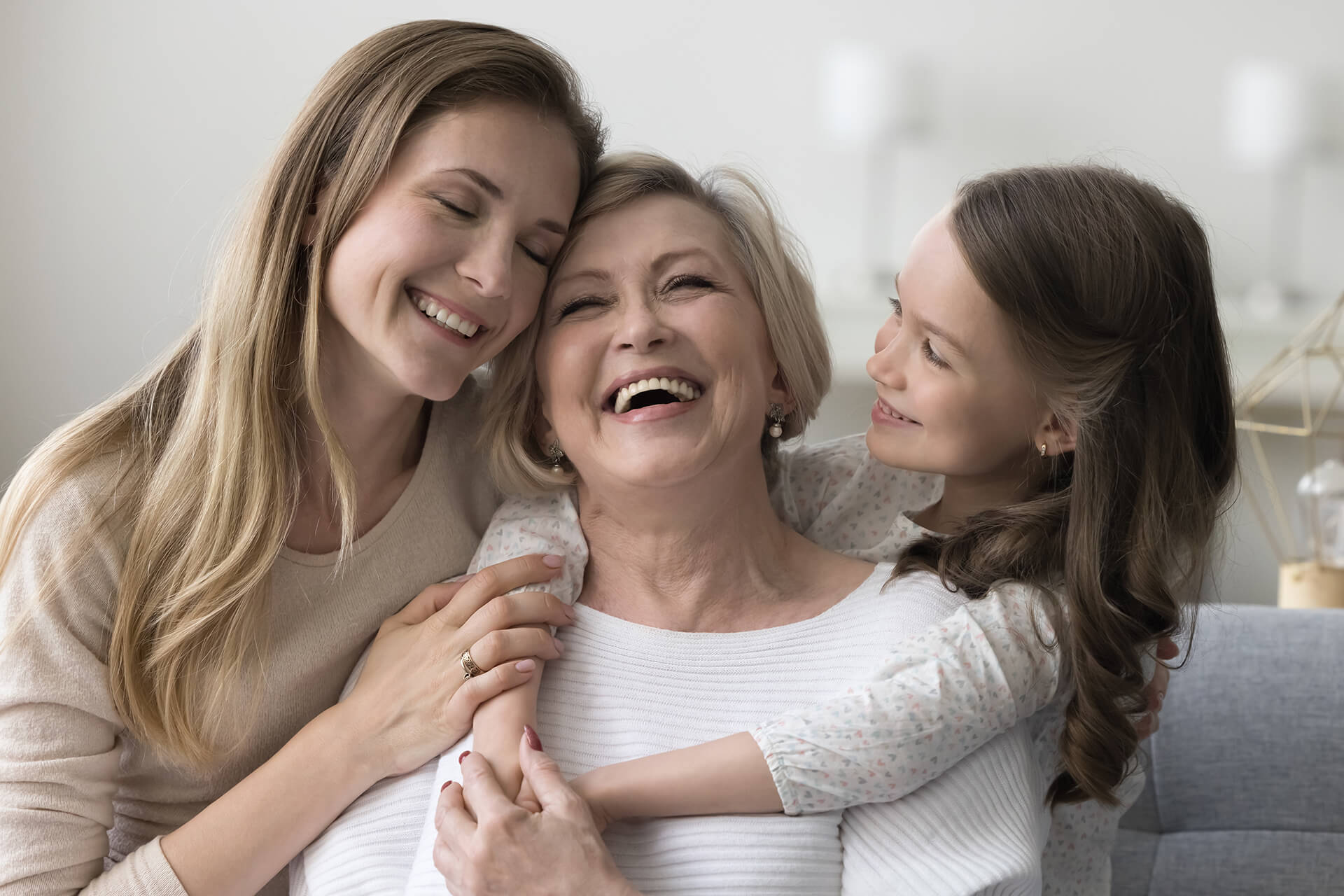 Woman hugging daughter and granddaughter